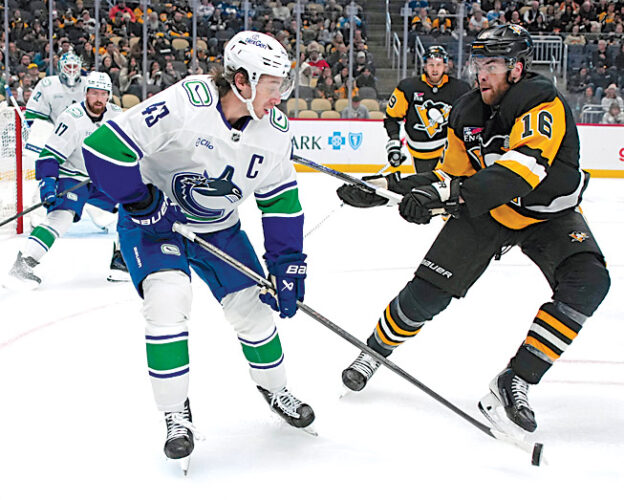 Sidney Crosby, Kris Letang hit milestones in Pittsburgh Penguins' win over Vancouver Canucks